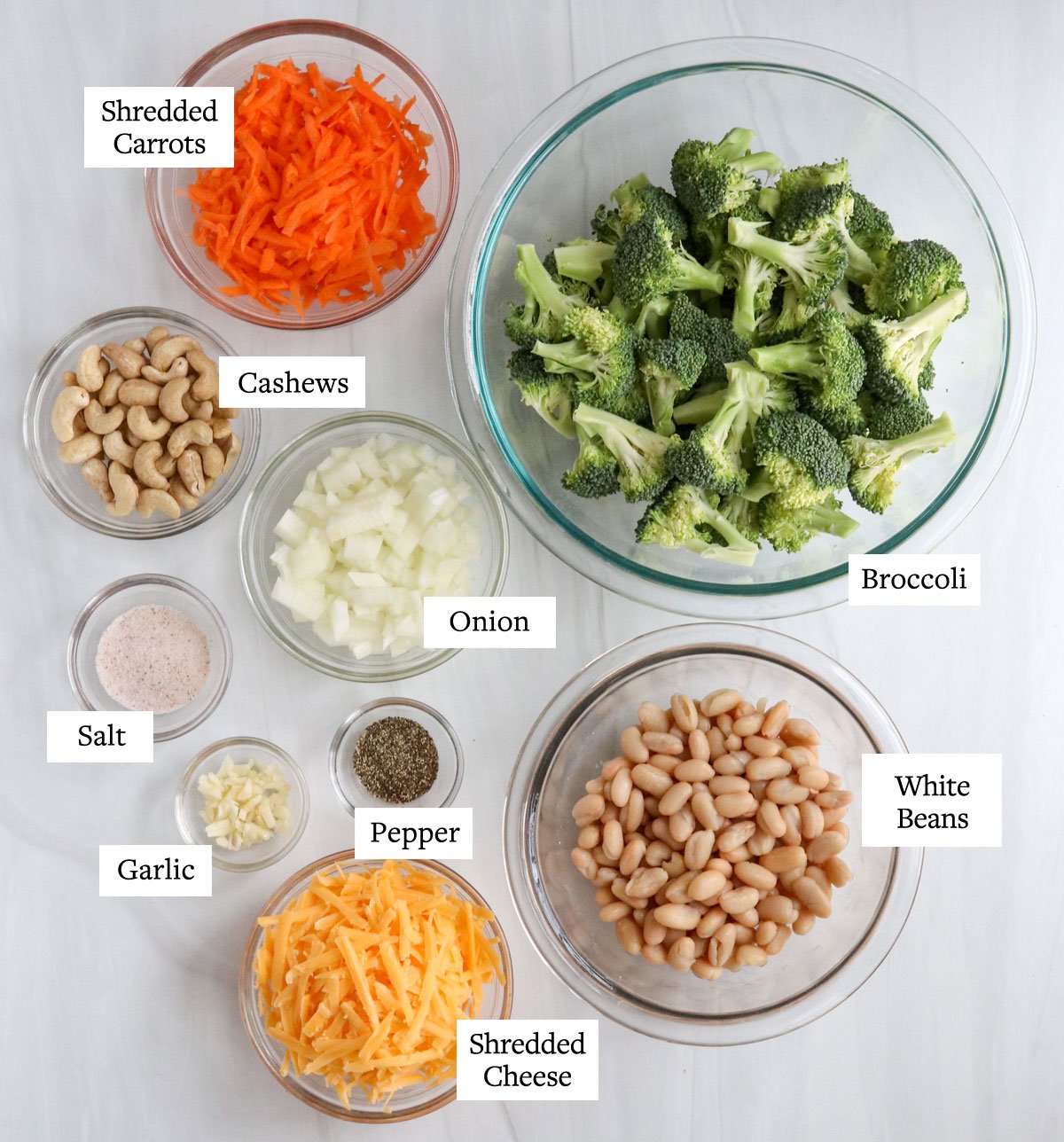 healthy broccoli soup ingredients in glass bowls.