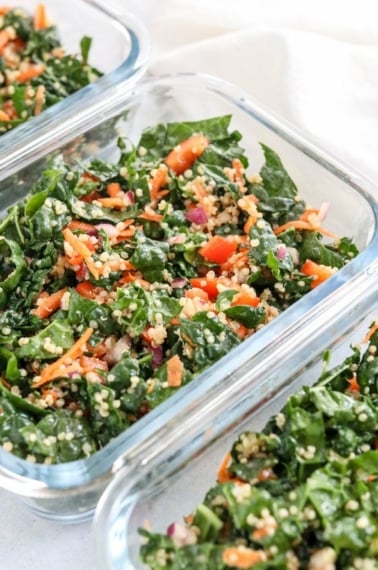 meal prep containers with kale quinoa salad